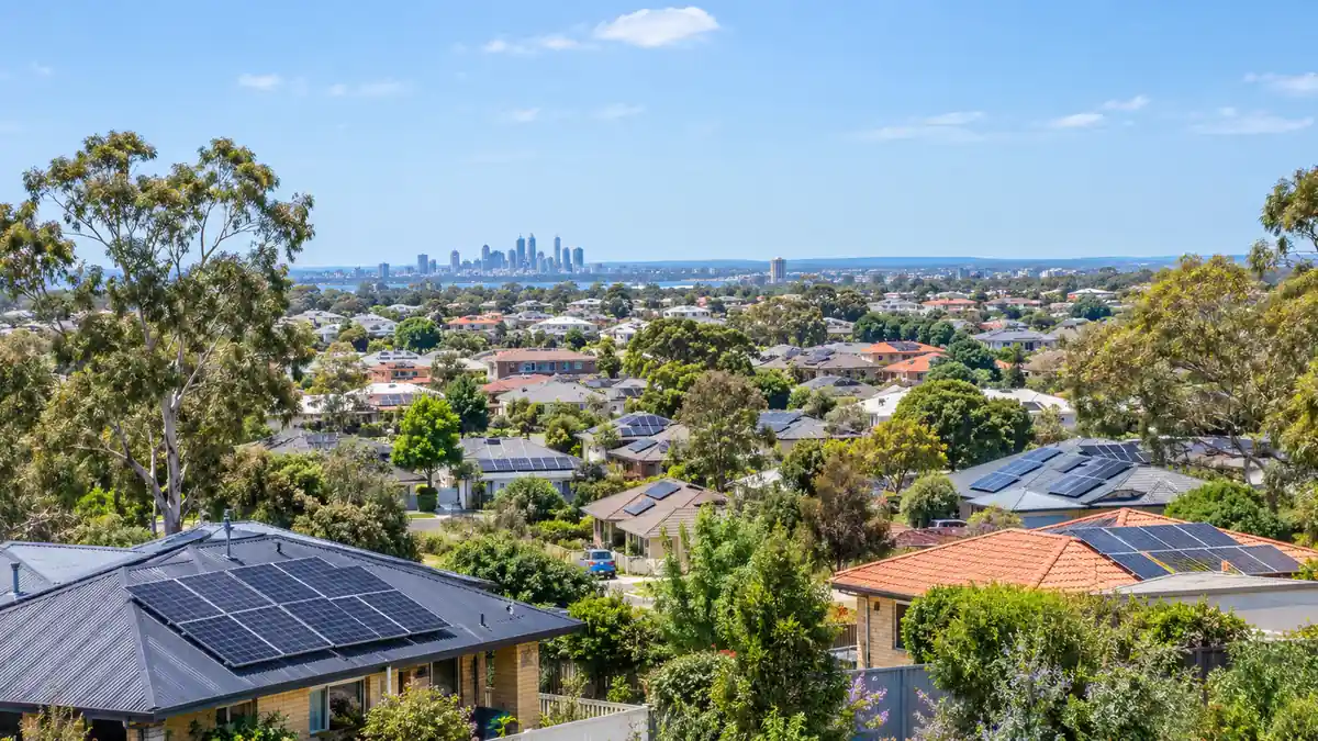Perth suburban rooftops covered in solar panels on a sunny spring day